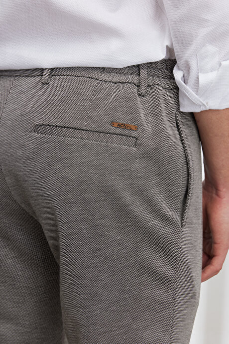 Slim Fit Dar Kesim Kuşgözü Desenli Beli Bağlamalı Bej Pantolon resmi