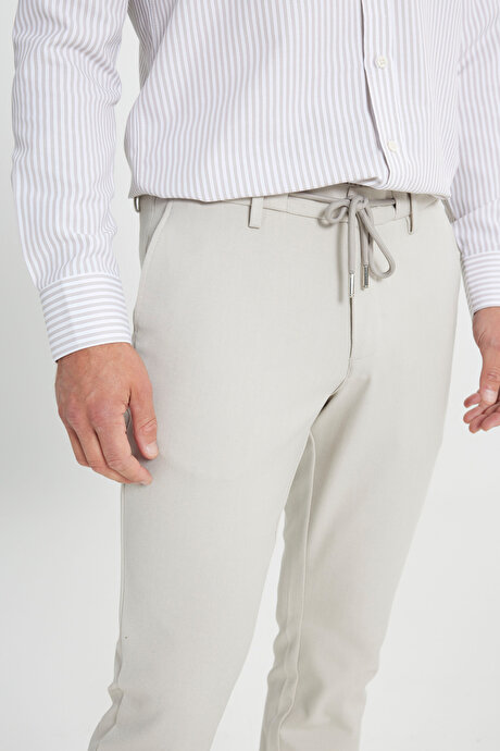 Slim Fit Dar Kesim Beli Bağlamalı Desenli Esnek Bej Pantolon resmi