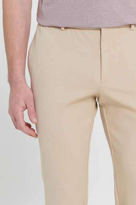 360 Derece Her Yöne Esneyen Slim Fit Dar Kesim Diagonal Desenli Beli Bağlamalı Örme Bej Pantolon resmi