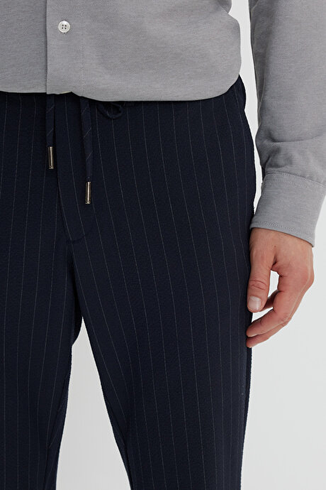 Yumuşak Dokulu Slim Fit Beli Bağlamalı Yan Cepli Gofre Desenli Lacivert Pantolon resmi