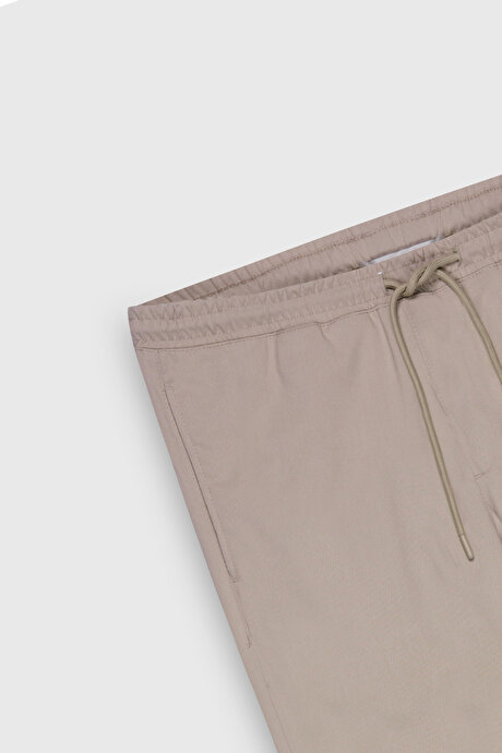 Non-Iron Ütü Gerektirmeyen Diz İzi Yapmayan Beli Bağlamalı Slim Fit Dar Kesim Jogger Bej Pantolon resmi