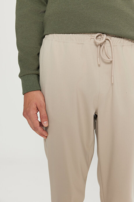 Slim Fit Rahat Kesim Beli Bağlamalı Yan Cepli Esnek Jogger Bej Pantolon resmi