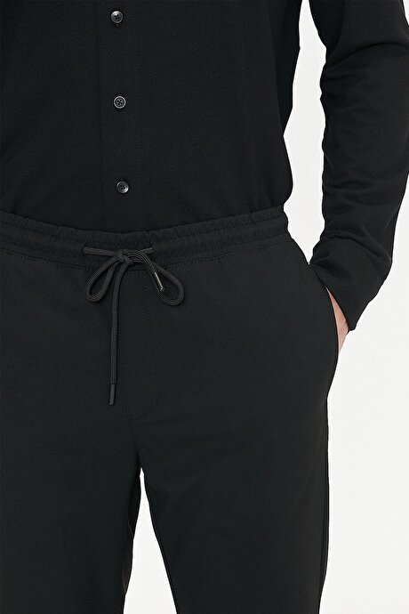 Non-Iron Ütü Gerektirmeyen Diz İzi Yapmayan Beli Bağlamalı Slim Fit Dar Kesim Jogger Siyah Pantolon resmi