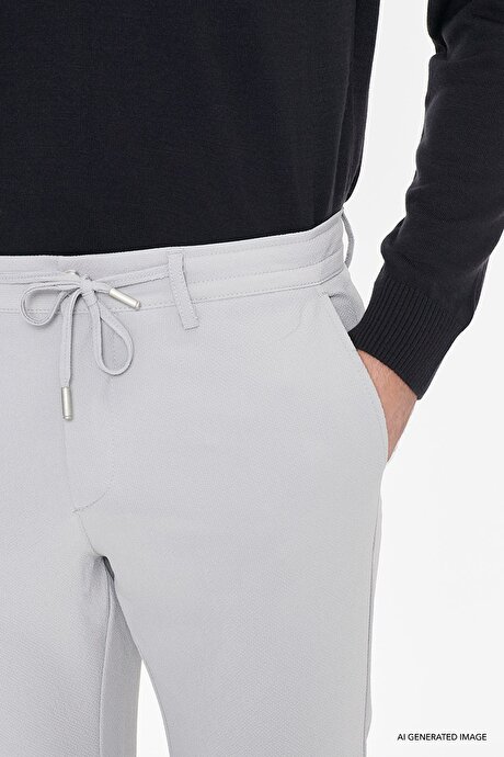 Slim Fit Dar Kesim Beli Bağlamalı Yan Cep Gofre Desenli Gri Pantolon resmi