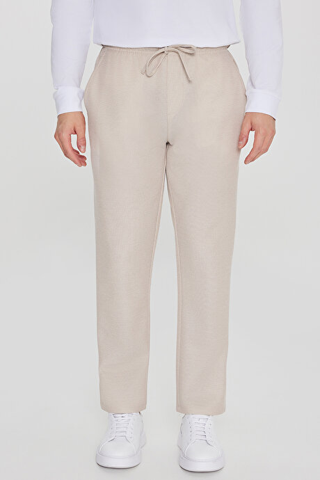 Pamuklu Standart Fit Normal Kesim Beli Lastikli Diagonal Desenli Örme Bej Pantolon resmi