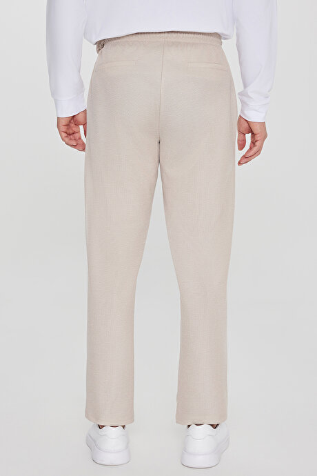 Pamuklu Standart Fit Normal Kesim Beli Lastikli Diagonal Desenli Örme Bej Pantolon resmi