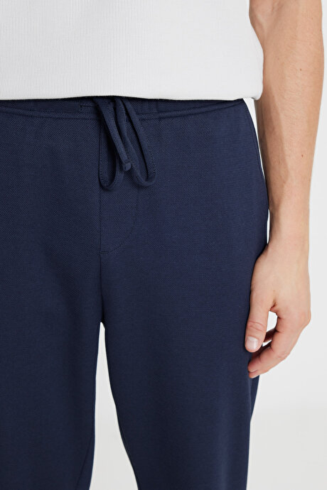 Pamuklu Standart Fit Normal Kesim Beli Lastikli Diagonal Desenli Örme Lacivert Örme Pantolon resmi