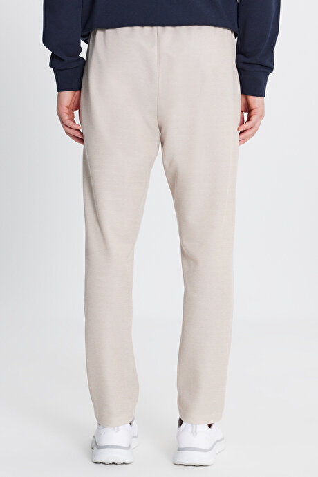 Pamuklu Standart Fit Normal Kesim Beli Bağlamalı Yan Cepli Jakarlı Bej Eşofman Altı resmi