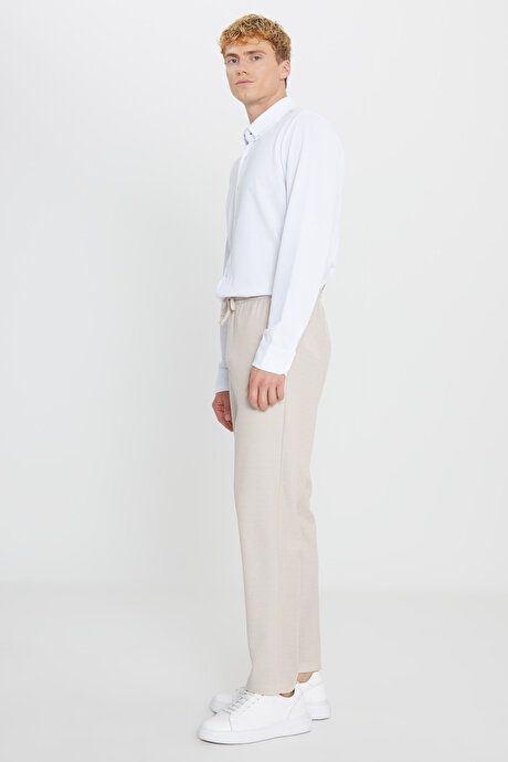 Pamuklu Standart Fit Normal Kesim Beli Bağlamalı Yan Cepli Jakarlı Bej Eşofman Altı resmi