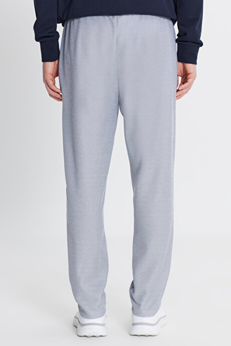 Pamuklu Standart Fit Normal Kesim Beli Bağlamalı Yan Cepli Jakarlı Lacivert Melanj Eşofman Altı resmi