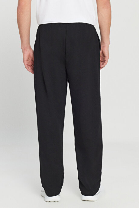 Pamuklu Baggy Fit Rahat Kesim Beli Bağlamalı Yan Cepli Örme Siyah Eşofman Altı resmi