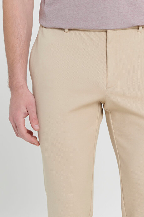 360 Derece Her Yöne Esneyen Slim Fit Dar Kesim Diagonal Desenli Beli Bağlamalı Örme Bej Pantolon resmi