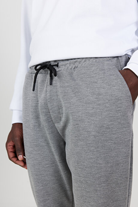 Standart Fit Beli ve Paçası Lastikli Rahat Spor Gri Melanj Eşofman Altı resmi