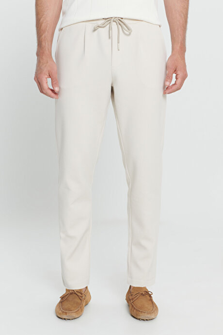 Pamuklu Slim Fit Dar Kesim Yan Cepli Normal Bel Esnek Örme Bej Örme Pantolon resmi