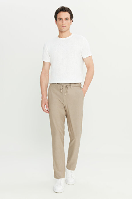 Slim Fit Dar Kesim Beli Bağlamalı Yan Cepli Gofre Desenli Esnek Bej Pantolon resmi