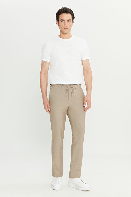 Slim Fit Dar Kesim Beli Bağlamalı Yan Cepli Gofre Desenli Esnek Bej Pantolon resmi