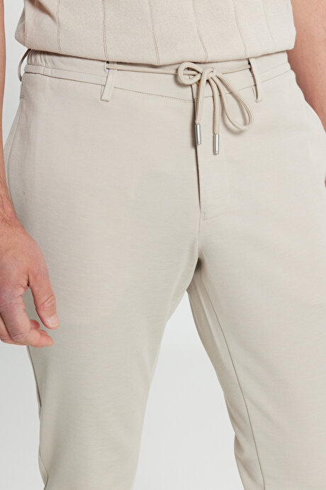Slim Fit Dar Kesim Beli Bağlamalı Yan Cep Esnek Casual Bej Pantolon resmi